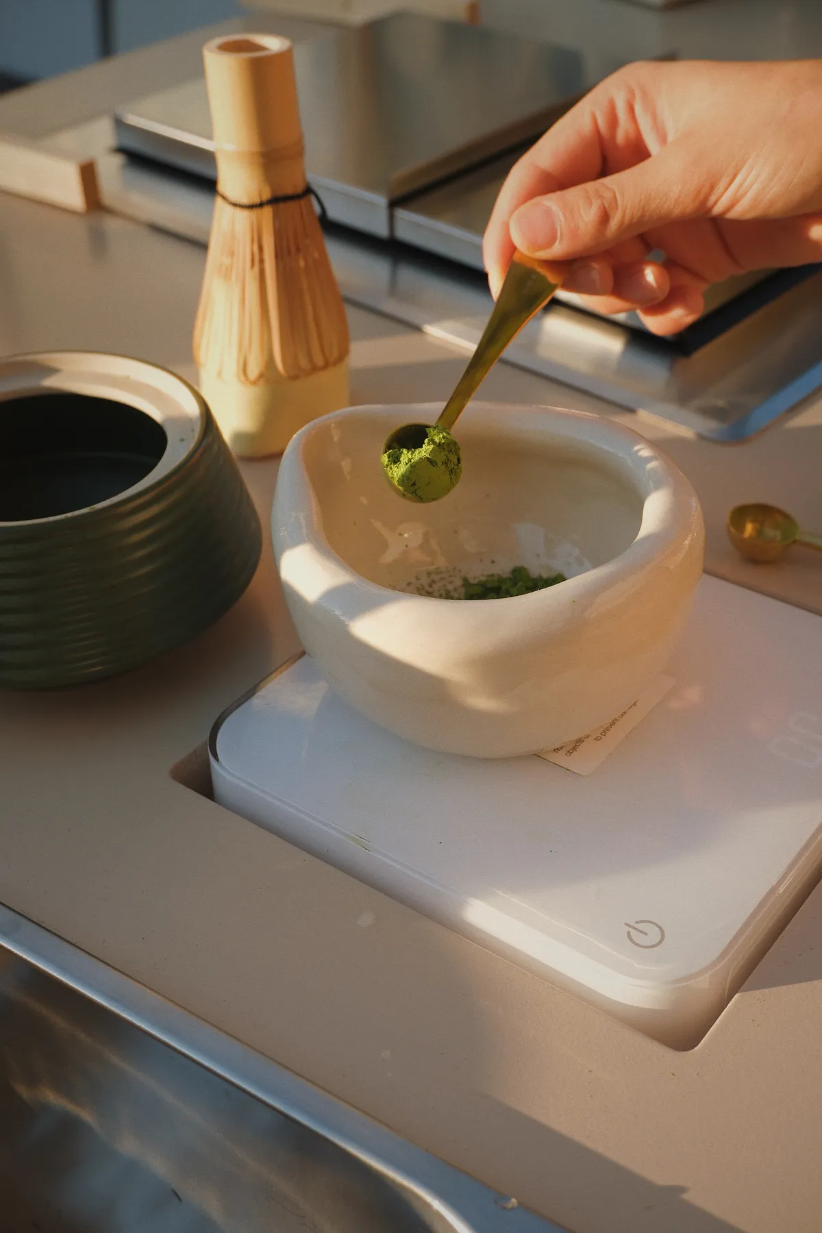 Ceremonial-grade matcha being measured at the cart